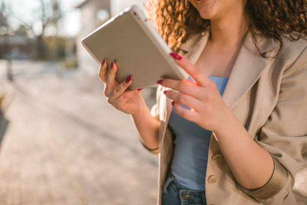 istock An unrecognizable female student holds a digital tablet in her hands 1477674172