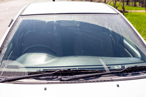 istock Dirty front windshield of a white car closeup 1477675227