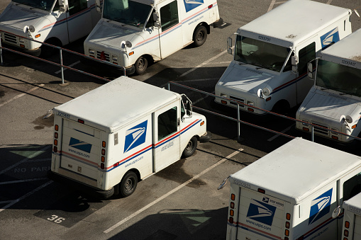 Watsonville, California, USA - January 1, 2023: A USPS (United States Postal Service) mail truck parks for the evening.