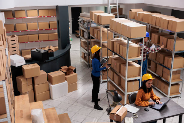 istock Warehouse employees team working in order fulfillment center 1477680086