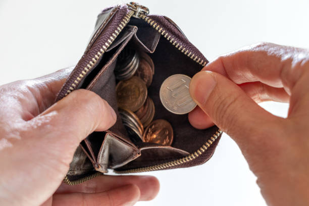 istock Take coins out of small leather wallet 1477683574