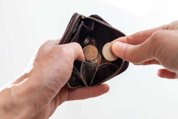istock Take coins out of small leather wallet 1477683585