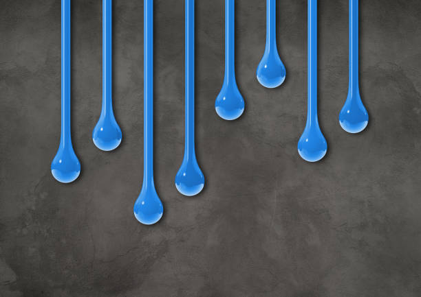 istock Blue ink drops on dark concrete wall. Horizontal wallpaper 1477684191