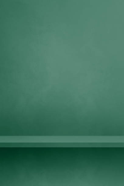 istock Empty shelf on a dark green concrete wall. Background template. Vertical mockup 1477684918