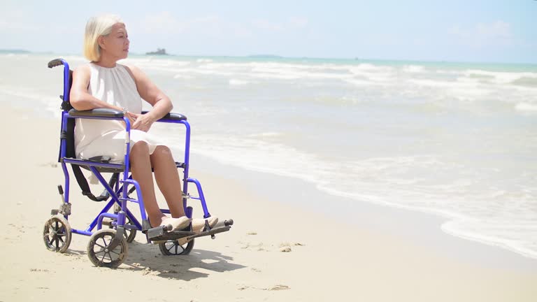 Wheelchair At The Beach On The Summer