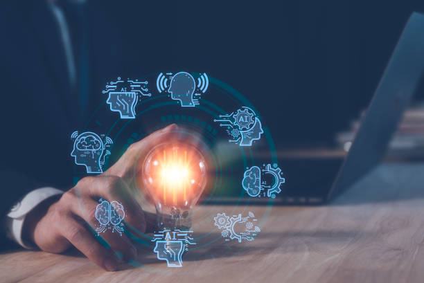 istock AI technology concept, man using AI tech to working business project, businessman working on computer laptop and touching light bulb with AI icons, creative and new idea concept. 1477692177