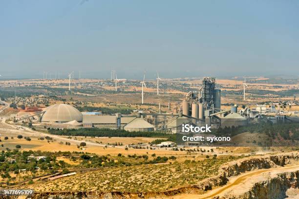 View To Limestone Mining For Cement With Windmills Stock Photo - Download Image Now - Mining - Natural Resources, Cement Factory, Construction Site