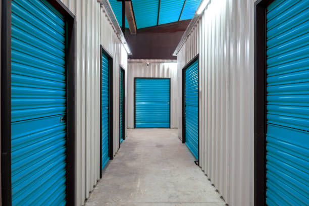 istock Corridor of self storage unit with blue doors. Rental Storage Units 1477695142
