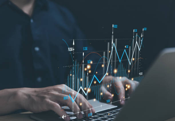 istock Stock trading on laptop showing graph chart 1477696148