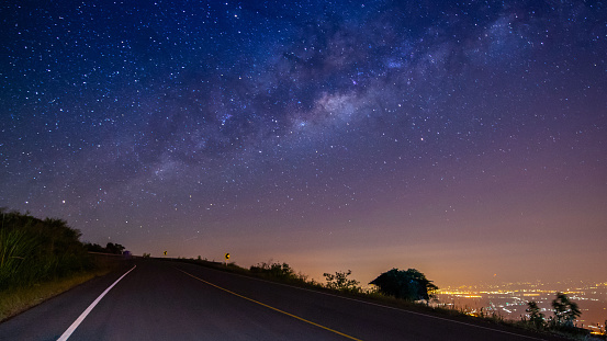 night landscape road on mountain and milky way galaxy background ,Thailand , long exposure , low light