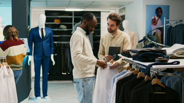 istock African american man checking merchandise on hangers 1477699139