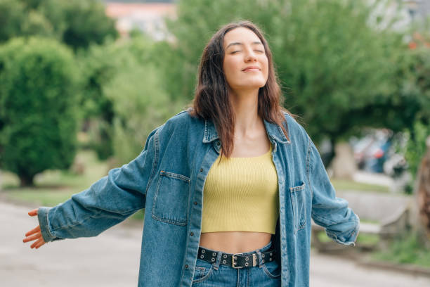 istock girl breathing deeply outdoors, relax 1477702228