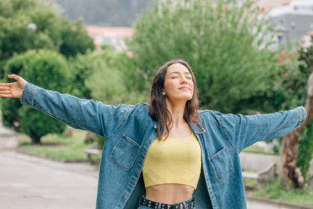 istock girl breathing deeply outdoors, relax 1477702256