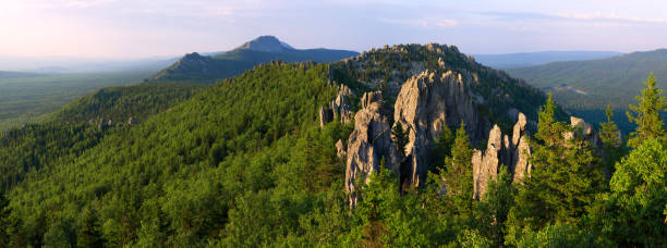 istock Mountain range at sunset. Beautiful mountain rocks illuminated by evening light. 1477705238
