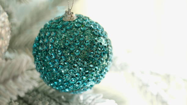 istock Bright blue christmas tree ball with shiny stones closeup 1477705769