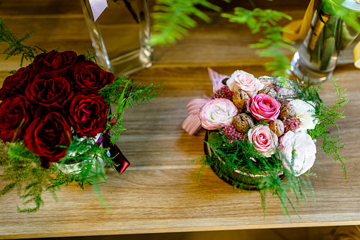 Close-up view of a beautiful bouquet of roses in a basket in a flower shop.