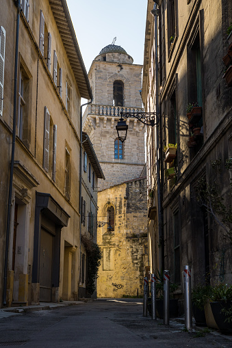 Bell tower of the Saint-Martin Church from Rue du Séminaire, in the medieval district of Méjan in Arles