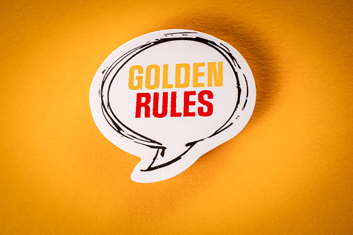 Golden Rules concept. Speech bubble with text on yellow background.