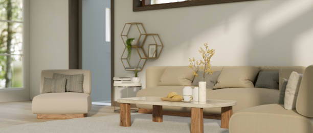 istock Comfortable and minimalist living room interior design with cozy couch, coffee table 1477720337