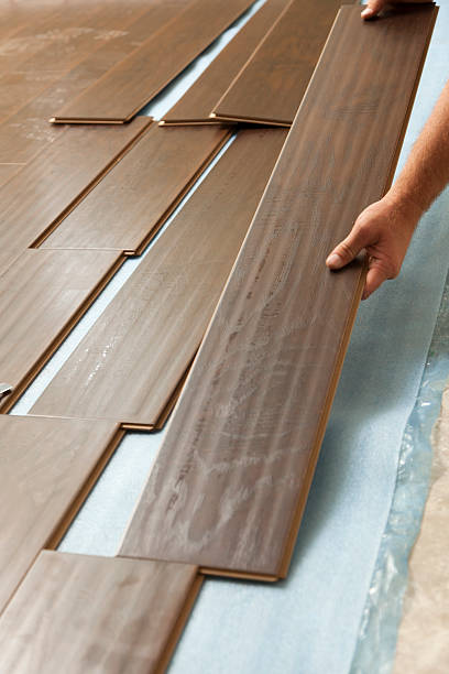 istock Man Installing New Laminate Wood Flooring 147772090