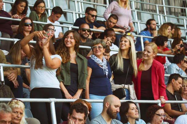 istock People taking a selfies at a footbal match 1477724363