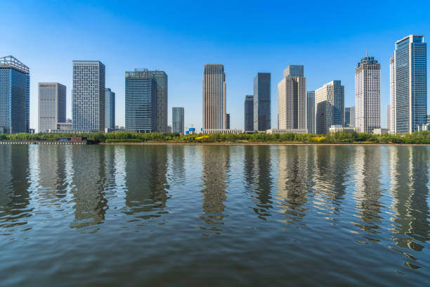 istock Business district office buildings and water reflection in Beijing 1477729892
