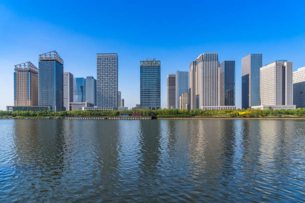istock Business district office buildings and water reflection in Beijing 1477729894