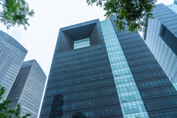 istock modern office building with green leaves 1477730450