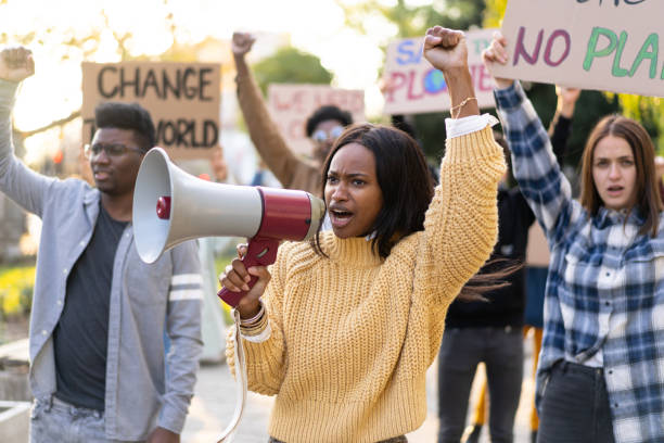 istock Young group of activists demonstrating against global warming 1477731308