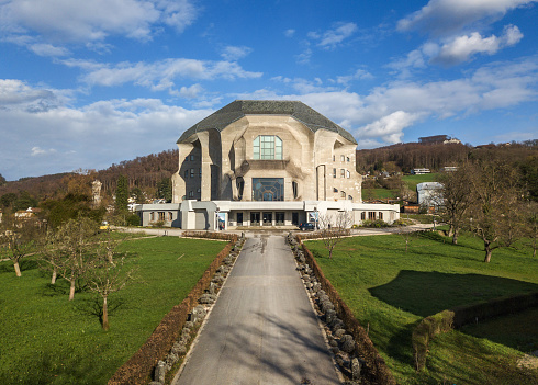 Dornach, Switzerland - March 27. 2023: Aerial image of the Goetheanum II, desigen by Rudolf Steiner in Expressionistic architecture style in 1924, is the world center for anthroposophical movement.