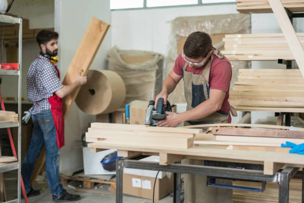 istock Carpenter cutting wooden planks 1477733525