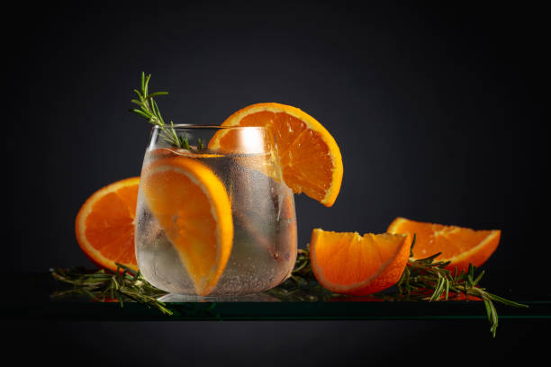 istock Cocktail with ice, orange, and rosemary. 1477737871
