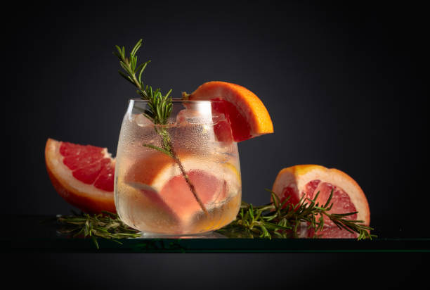 istock Cocktail gin tonic with ice, grapefruit, and rosemary. 1477737875