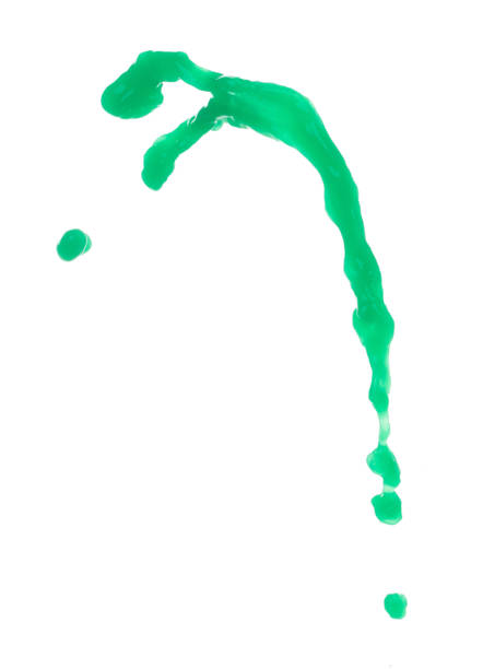Green paint liquid fly in mid air, apple vegetable juice falling scatter, explosion float in shape form droplet line. White background isolated freeze motion high speed shutter
