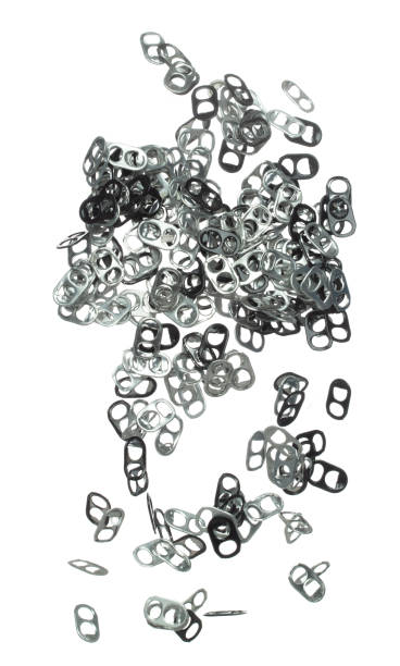 istock Can Caps fly in mid air, aluminium canned cap falling scatter, recycle from trash can cap explosion float. White background isolated freeze motion high speed shutter 1477741560