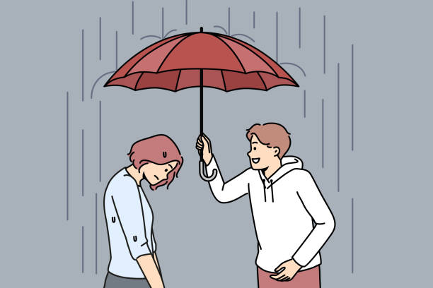 istock Caring man cover unhappy woman with umbrella 1477741788