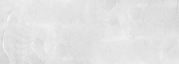 istock Background texture of old white concrete wall for background,  Empty abstract cement wall, and studio room for display products horizontal design for pattern and background. 1477743462