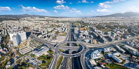 Aerial view of multilevel junction ring road as seen in Attiki Odos toll road motorway interchange with Kifisias Avenue in Marousi Attica, Athens, Greece