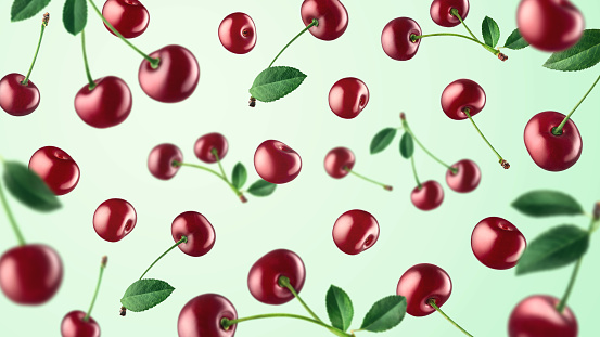 Colorful pattern of fresh ripe red cherries on light mint background