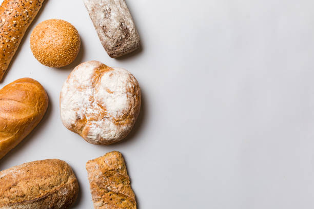istock Homemade natural breads. Different kinds of fresh bread as background, top view with copy space 1477751712