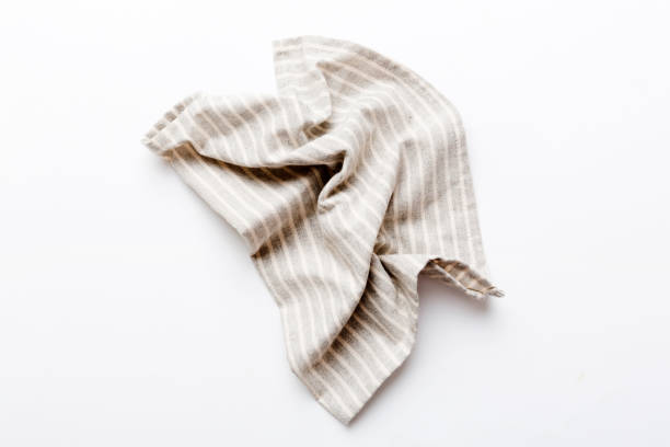 istock top view with gray kitchen napkin isolated on table background. Folded cloth for mockup with copy space, Flat lay. Minimal style 1477751835