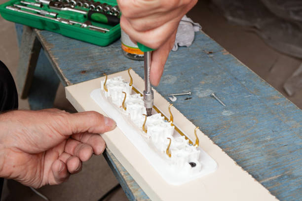 istock man making an extension cord socket outdoor 1477751864