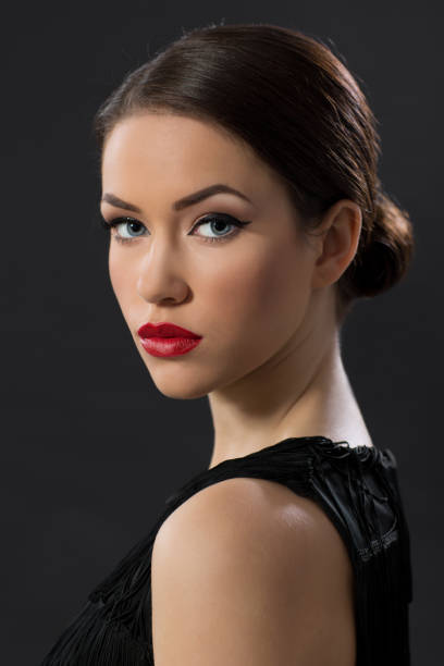 Beauty portrait of young woman looking over the shoulder