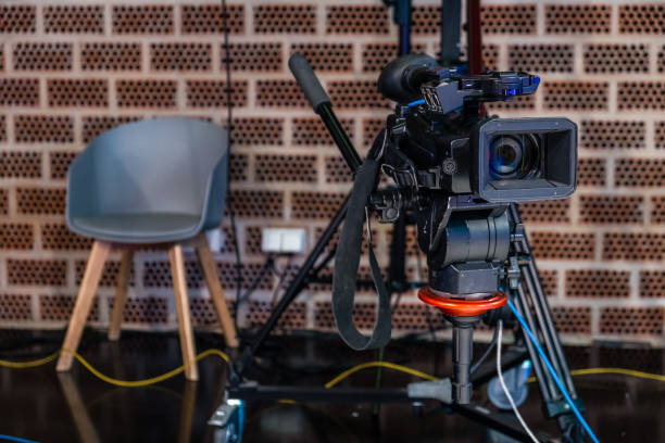 istock TV camera ready to record in a television studio. 1477757109