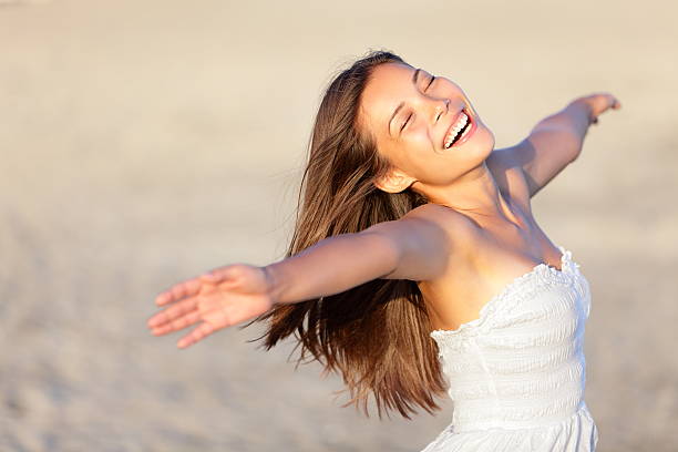 Happy vacation woman Happy vacation woman on beach summer holiday in cheerful bliss enjoying the sunshine. Beautiful ethnic girl in her 20s..Similars: sundress stock pictures, royalty-free photos & images