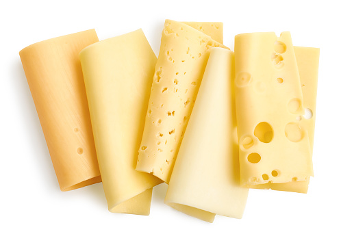 Group of different rolled cheese slices isolated on white background, top view. Maasdam, Cheddar, Gouda, Edam, Dutch