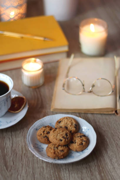 istock Books, Glasses, E-Reader, Pen, Tea, Cookies and Candles 1477765558