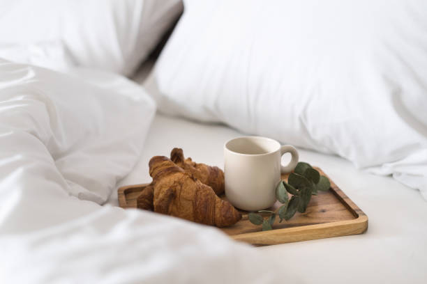istock breakfast in bed with coffee and croissants 1477765701