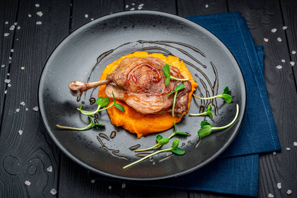 istock Grilled chicken leg with pumpkin puree. 1477767934