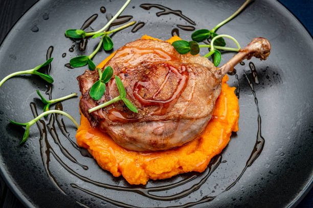 istock Grilled chicken leg with pumpkin puree. 1477767951
